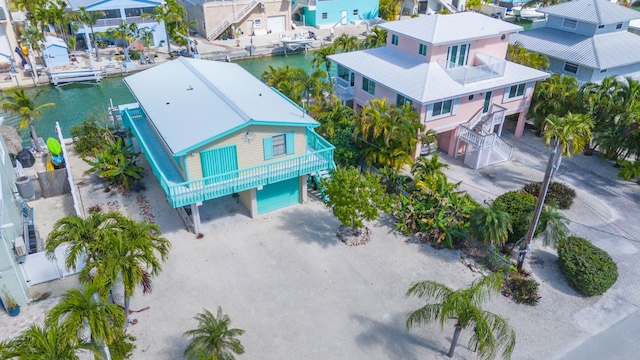 birds eye view of property featuring a water view and a residential view