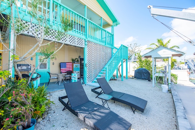 view of patio / terrace with stairway and area for grilling