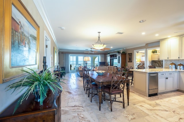 250 W Seaview Cir, Duck, FL 33050 - dining space featuring ceiling fan, visible vents, ornamental molding, recessed lighting, and stone tile floors