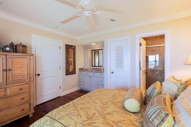bedroom featuring baseboards, ornamental molding, connected bathroom, and dark wood-type flooring