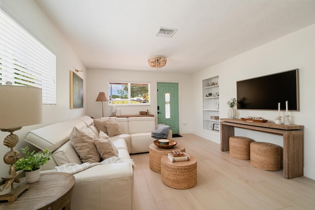 125 Harbor Dr, Key Largo, FL 33037 - living area with light wood-style flooring and built in features