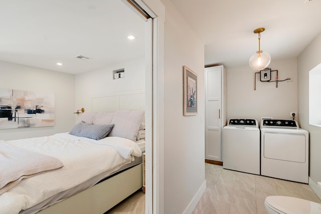 125 Harbor Dr, Key Largo, FL 33037 - bedroom with separate washer and dryer, recessed lighting, and light marble finish flooring