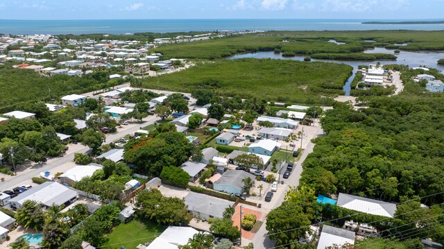 125 Harbor Dr, Key Largo, FL 33037 - aerial perspective of suburban area featuring a nearby body of water and property parcel outlined
