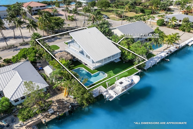 bird's eye view with a water view and a residential view