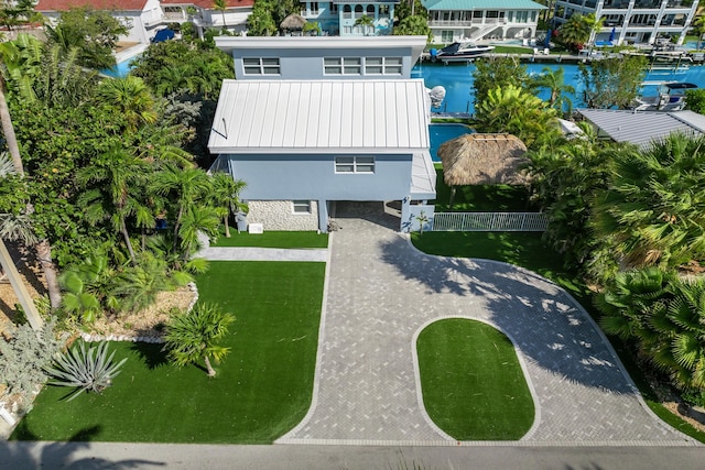 birds eye view of property with a water view
