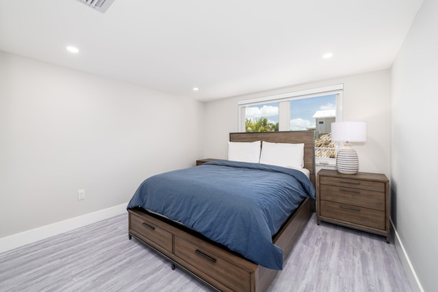 bedroom with recessed lighting, baseboards, and light wood-style floors