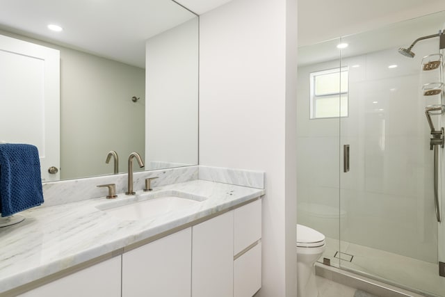 full bathroom with recessed lighting, vanity, a stall shower, and toilet