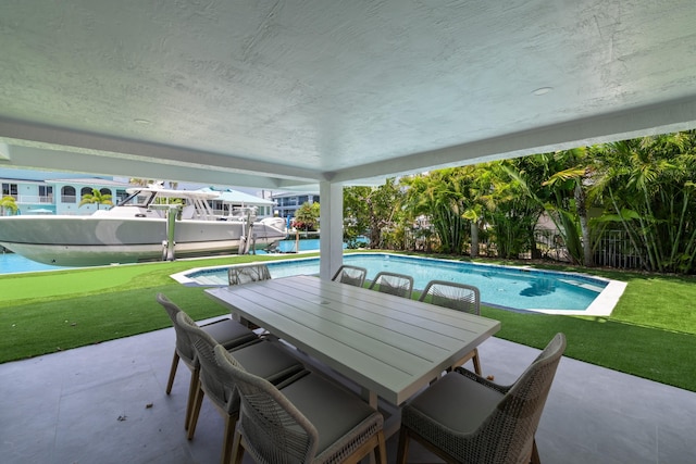 view of patio featuring an outdoor pool and outdoor dining space