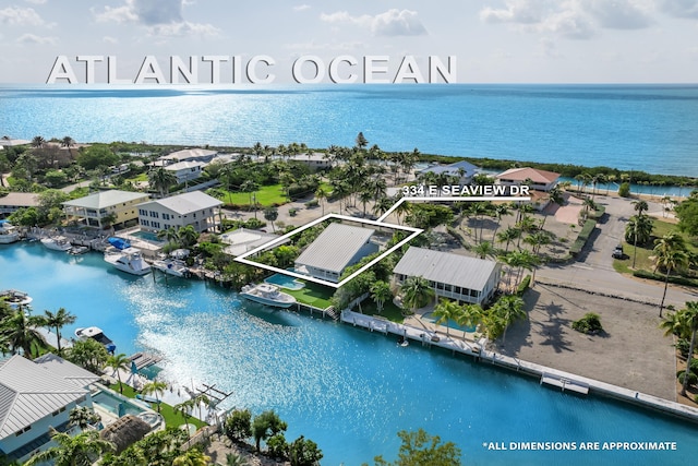 bird's eye view with a water view and a residential view