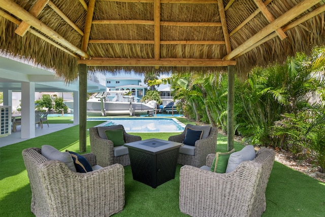 view of patio featuring a gazebo, an outdoor living space, and an outdoor pool