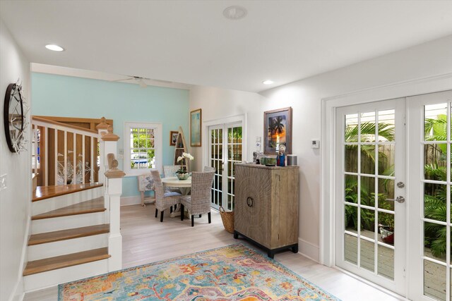 interior space featuring french doors and light wood-type flooring