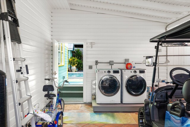 washroom with light tile patterned flooring and independent washer and dryer