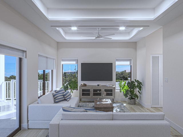 living room with light hardwood / wood-style floors and ceiling fan