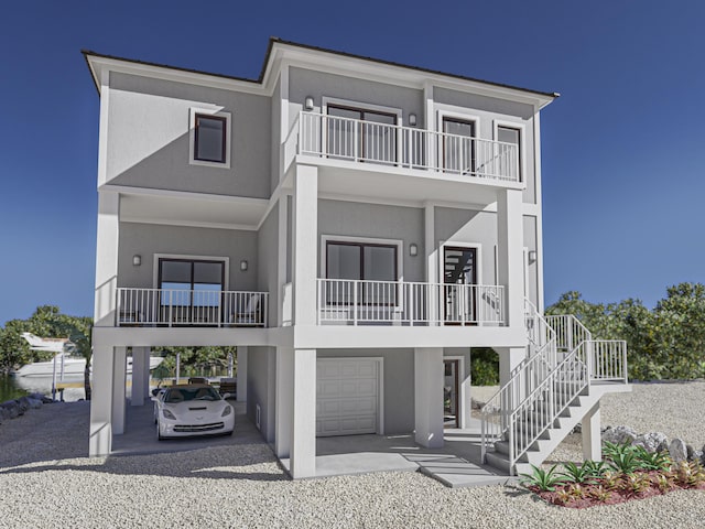 view of front of home featuring a garage and a balcony