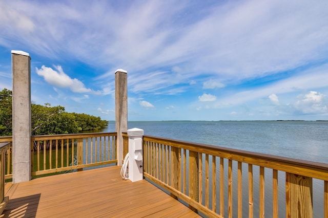 wooden deck featuring a water view