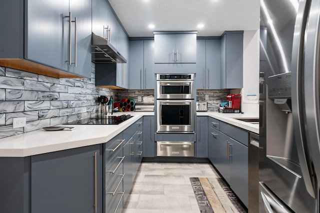 kitchen with tasteful backsplash and stainless steel appliances