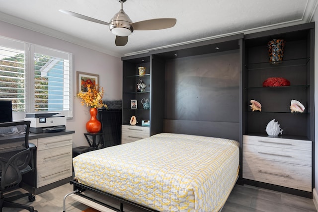 bedroom with ceiling fan, ornamental molding, and hardwood / wood-style floors