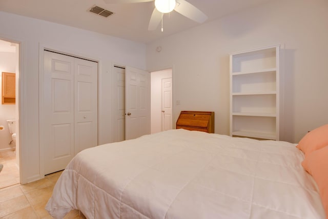 28212 Gato Rd, Little Torch, FL 33042 - tiled bedroom with multiple closets, ensuite bath, and a ceiling fan