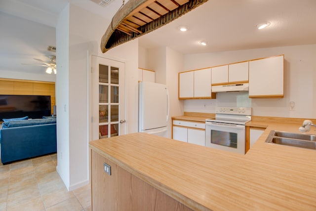 28212 Gato Rd, Little Torch, FL 33042 - kitchen with white appliances, under cabinet range hood, a ceiling fan, light countertops, and a peninsula