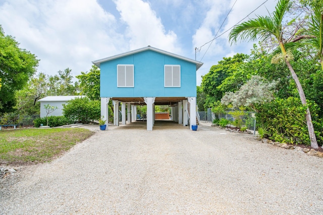 28212 Gato Rd, Little Torch, FL 33042 - view of front of house featuring a carport and gravel driveway
