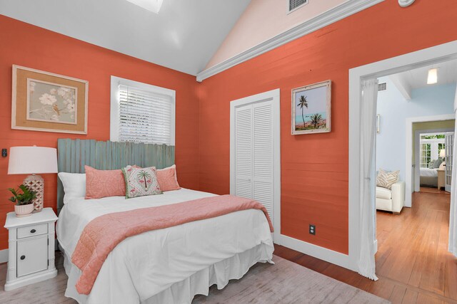 820 Carsten Ln, Key West, FL 33040 - bedroom with light wood-type flooring, lofted ceiling, and a closet