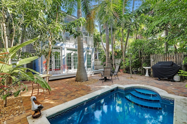 820 Carsten Ln, Key West, FL 33040 - view of pool featuring french doors, a grill, a patio area, and a wooden deck