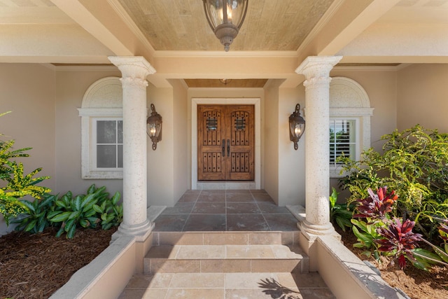 69 Cannon Royal Dr, Shark Key, FL 33040 - doorway to property featuring stucco siding and a porch