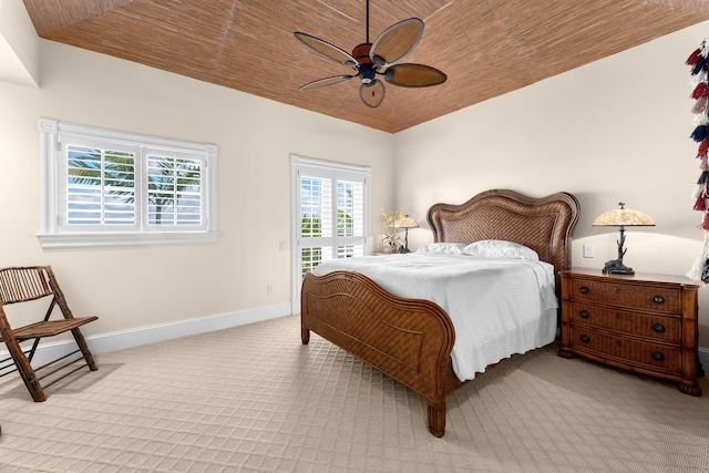 69 Cannon Royal Dr, Shark Key, FL 33040 - bedroom with baseboards, lofted ceiling, access to exterior, wood ceiling, and light carpet