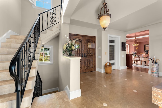 69 Cannon Royal Dr, Shark Key, FL 33040 - entrance foyer featuring stairs, baseboards, and a towering ceiling