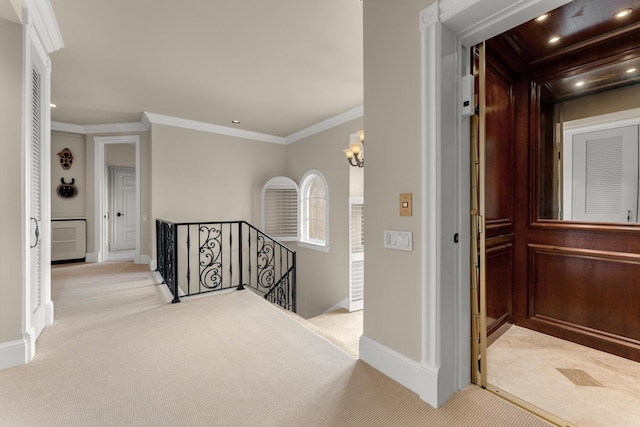 69 Cannon Royal Dr, Shark Key, FL 33040 - hallway with recessed lighting, an upstairs landing, light colored carpet, and ornamental molding