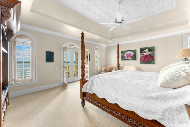 69 Cannon Royal Dr, Shark Key, FL 33040 - carpeted bedroom featuring baseboards, a tray ceiling, ornamental molding, french doors, and access to outside