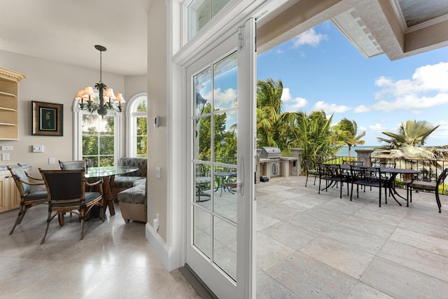 69 Cannon Royal Dr, Shark Key, FL 33040 - doorway to outside featuring a chandelier