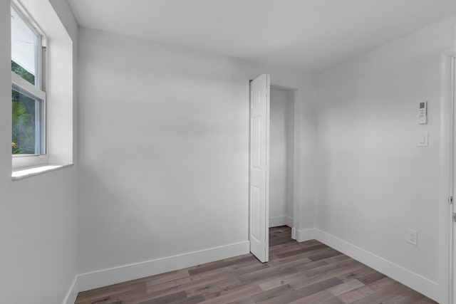 empty room with light hardwood / wood-style flooring