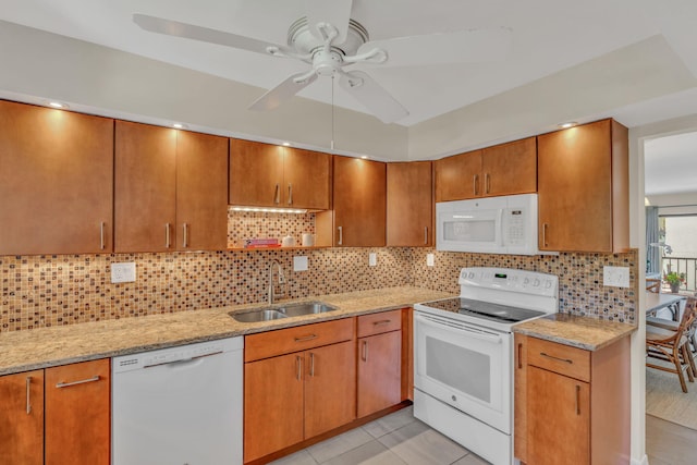 601 W Ocean Dr Unit 414D, Key Colony, FL 33051 - kitchen with white appliances, a sink, a ceiling fan, light stone countertops, and light tile patterned floors