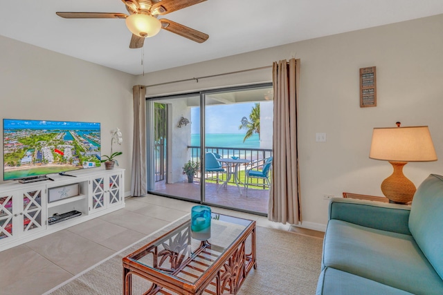 601 W Ocean Dr Unit 414D, Key Colony, FL 33051 - tiled living room with a ceiling fan, a water view, and baseboards