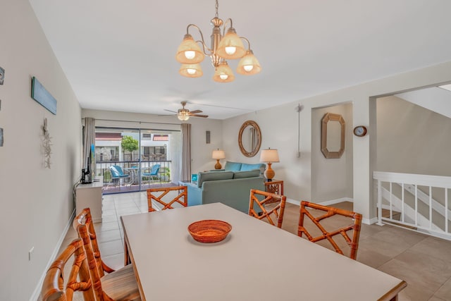 601 W Ocean Dr Unit 414D, Key Colony, FL 33051 - dining space with ceiling fan, a chandelier, baseboards, and tile patterned flooring