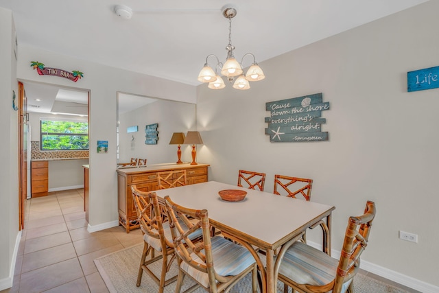 601 W Ocean Dr Unit 414D, Key Colony, FL 33051 - dining room with a chandelier, light tile patterned flooring, and baseboards