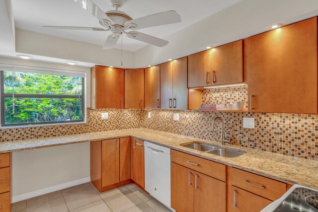 601 W Ocean Dr Unit 414D, Key Colony, FL 33051 - kitchen with dishwasher, a sink, light stone counters, light tile patterned floors, and decorative backsplash