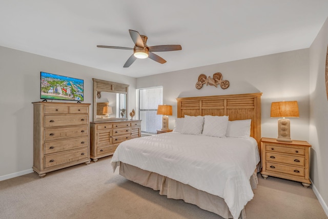 601 W Ocean Dr Unit 414D, Key Colony, FL 33051 - bedroom featuring light colored carpet, baseboards, and a ceiling fan