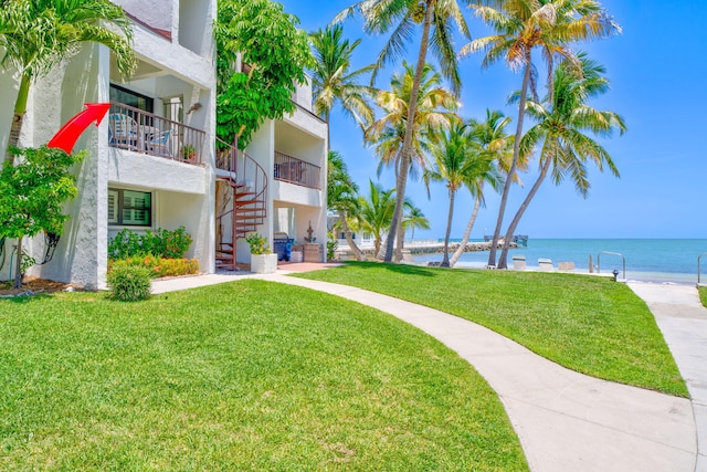 601 W Ocean Dr Unit 414D, Key Colony, FL 33051 - surrounding community featuring stairway, a water view, and a yard