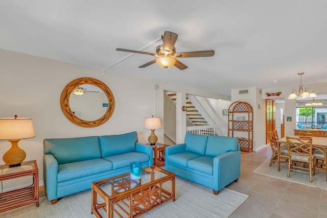 601 W Ocean Dr Unit 414D, Key Colony, FL 33051 - tiled living room featuring stairway, a ceiling fan, a chandelier, and baseboards