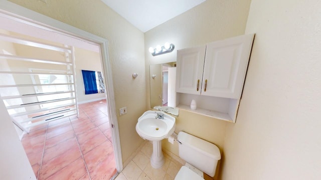 bathroom featuring tile patterned floors and toilet