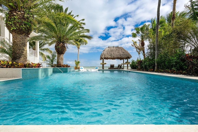 view of swimming pool featuring a gazebo and pool water feature