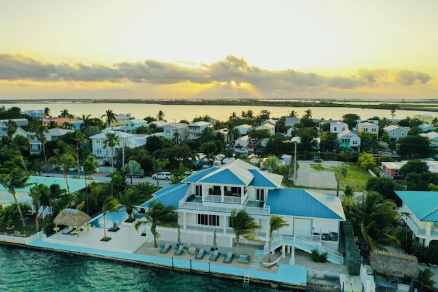 aerial view at dusk with a water view