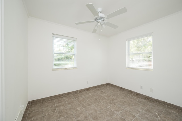 unfurnished room with crown molding, baseboards, and ceiling fan
