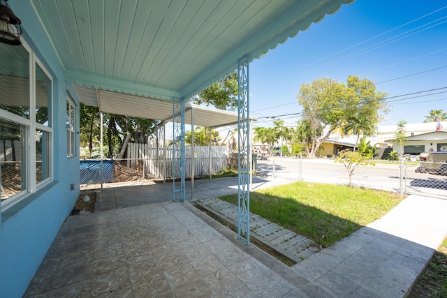 view of yard featuring fence and a patio area