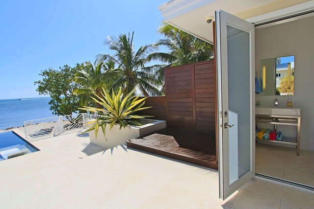 30 Ocean Front Dr, Key Largo, FL 33037 - view of patio with a water view