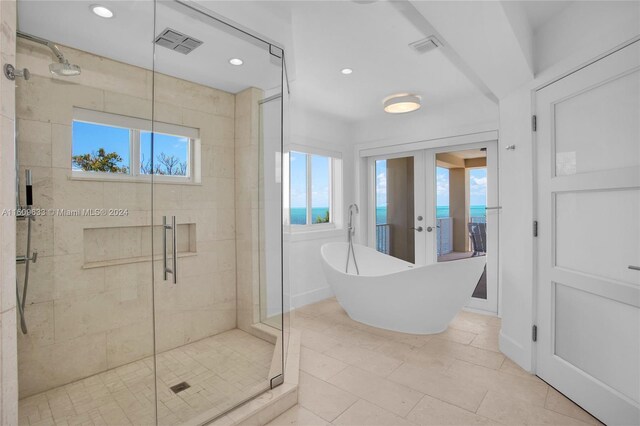 30 Ocean Front Dr, Key Largo, FL 33037 - bathroom with independent shower and bath and french doors