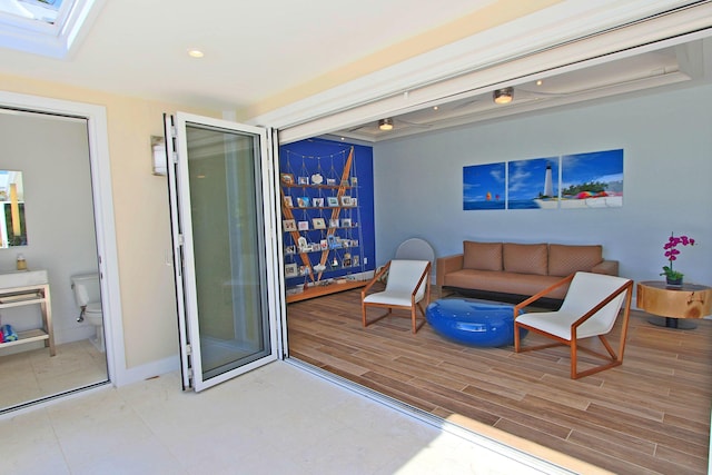 30 Ocean Front Dr, Key Largo, FL 33037 - living room featuring a skylight and hardwood / wood-style floors