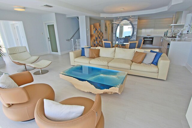 30 Ocean Front Dr, Key Largo, FL 33037 - living room featuring sink and a raised ceiling